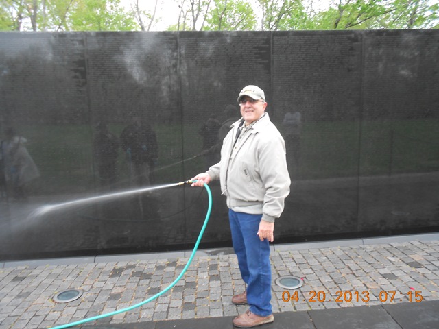 Charlie was drafted to hose the soap off after the cleaning.